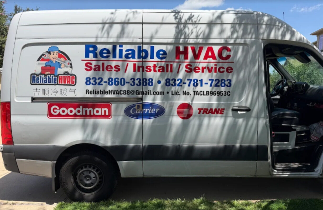 The Reliable HVAC service van, lettered with the company name, phone numbers, and Texas license number